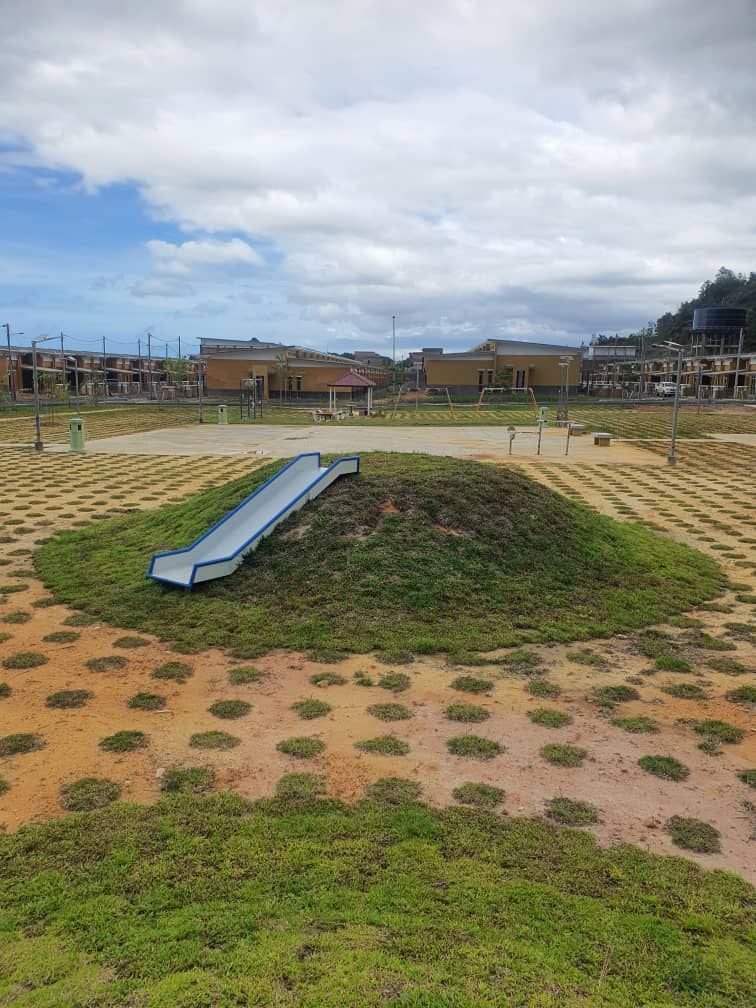 Grass mound installation at a community playground project